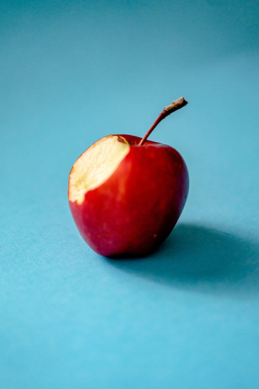 red apple on blue background