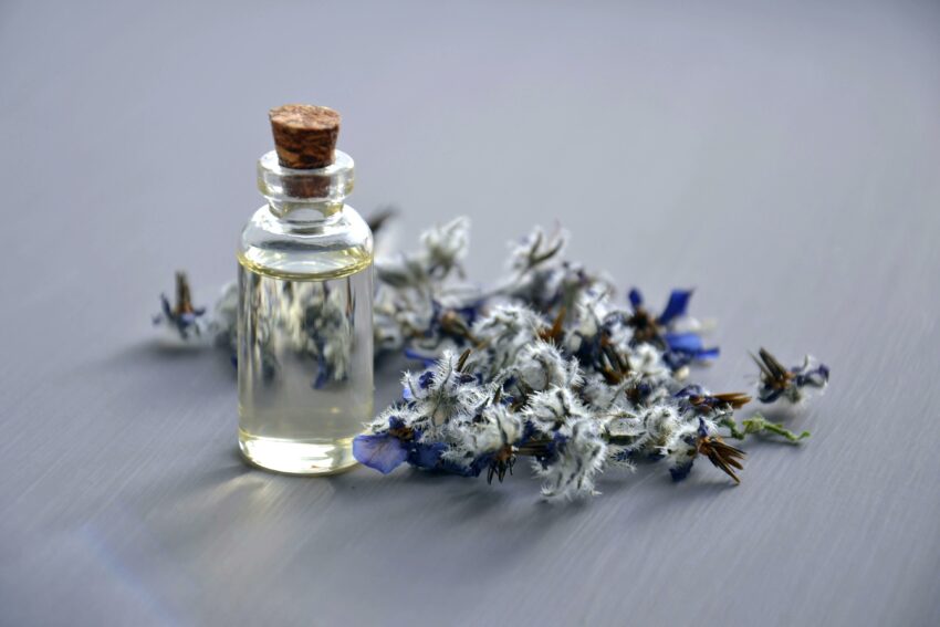 Vial and flowers.